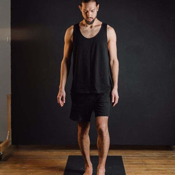 Person sitting in a lotus pose finding inner harmony.